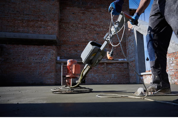 Concrete floor screeding and repair process by professional contractor in Nigeria